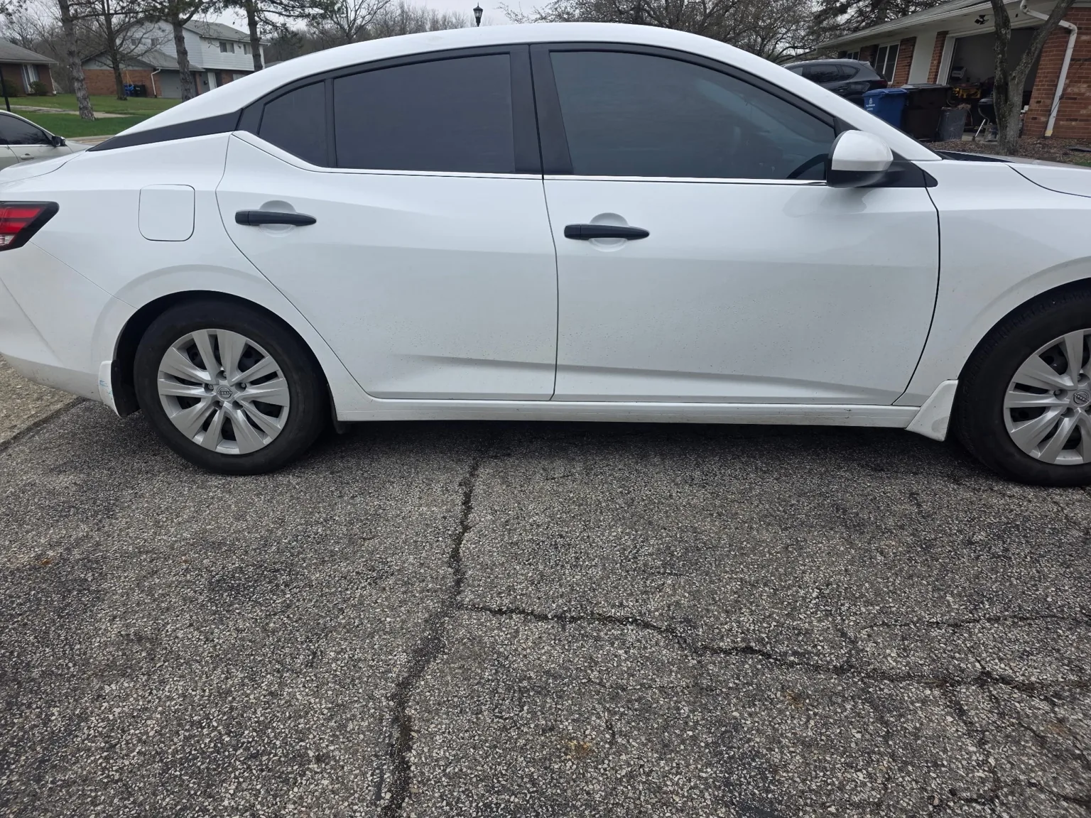 White sedan side profile by Senseful Auto Tint in Central Ohio